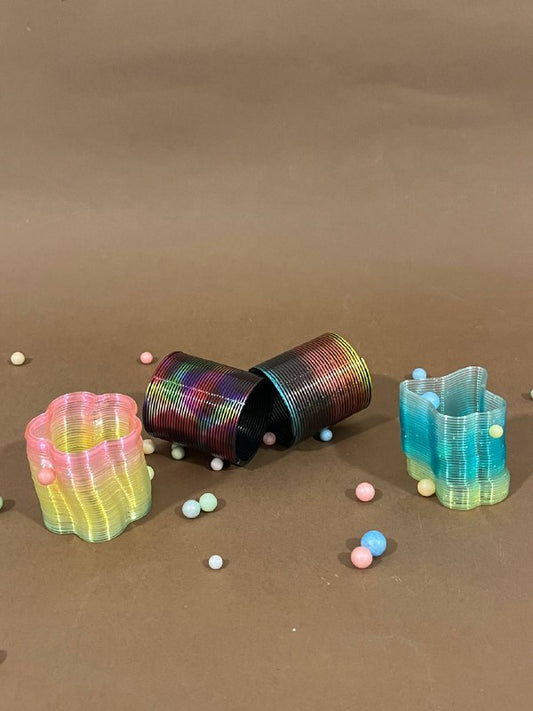 Rainbow Colored Plastic Spring Toy / لعبة زنبرك ملونة بألوان قوس قزح